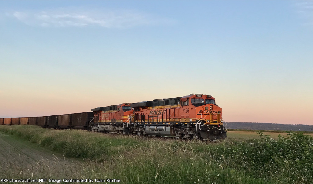 Trailing DPUs BNSF 7126/7712 E/B through the 104th Street crossing on an empty coal train from Robert's Bank.